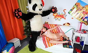 Christmas is the season when you are not supposed to stay alone, and although this blonde sexy girl seems to enjoy herself while decorating the tree and then masturbating she’s sent a real Santa Panda to give her Christmas gifts with one of them bei